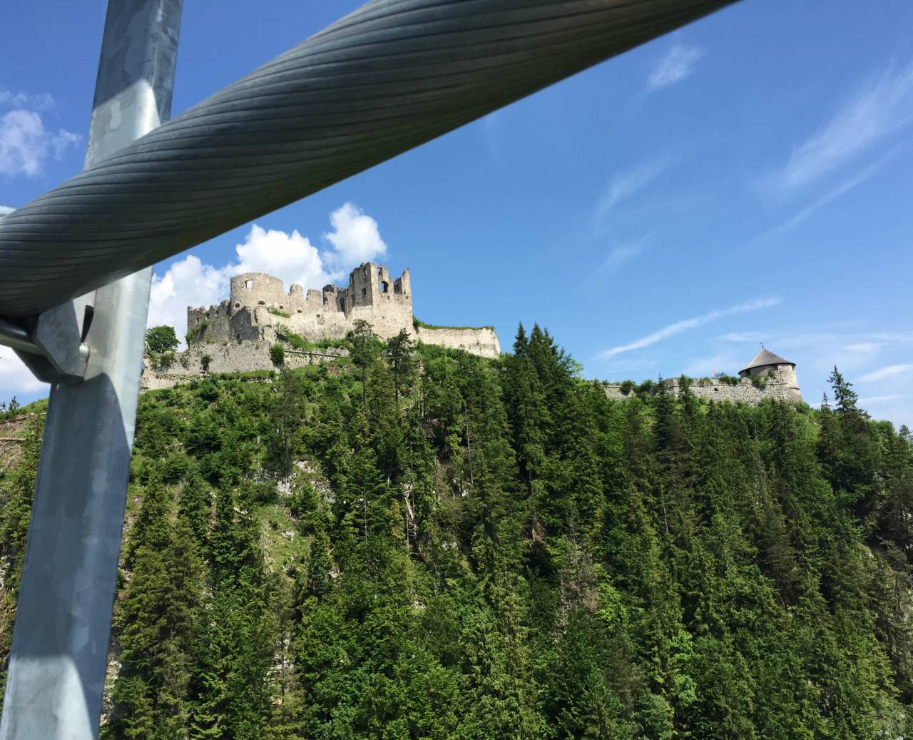 Ehrenberg castle ruins with panoramic forest view under a bright blue sky