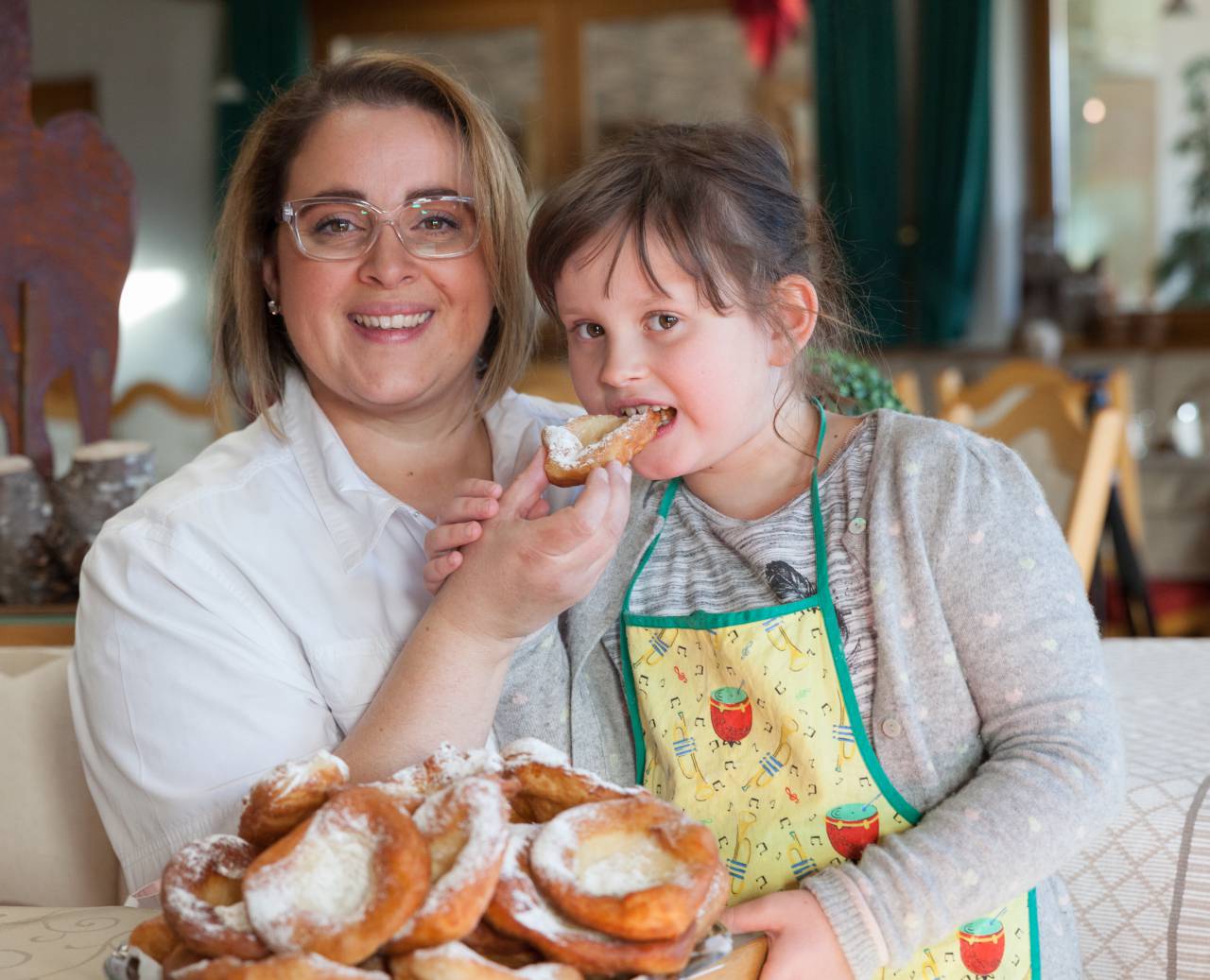 Host family Weirather with fresh Kiachln in the restaurant