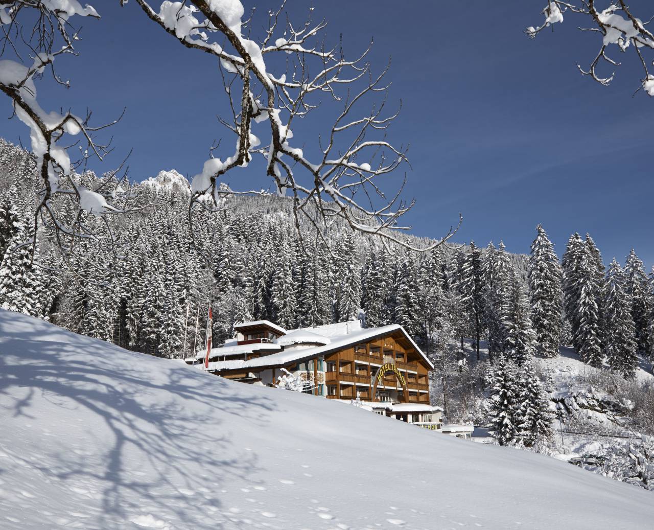 Panoramahotel Talhof in the middle of the snowy winter landscape in the mountains